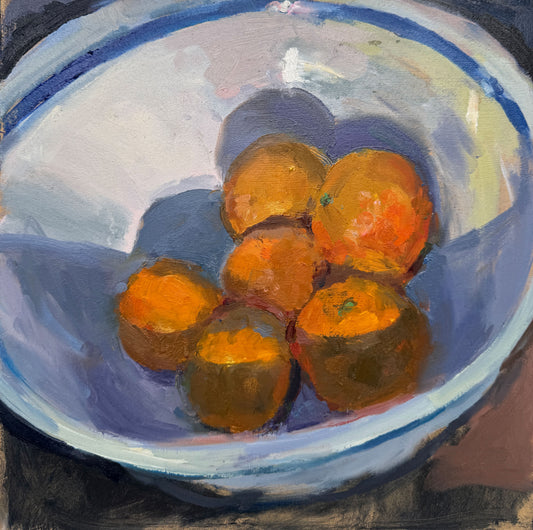 Blue striped bowl with oranges