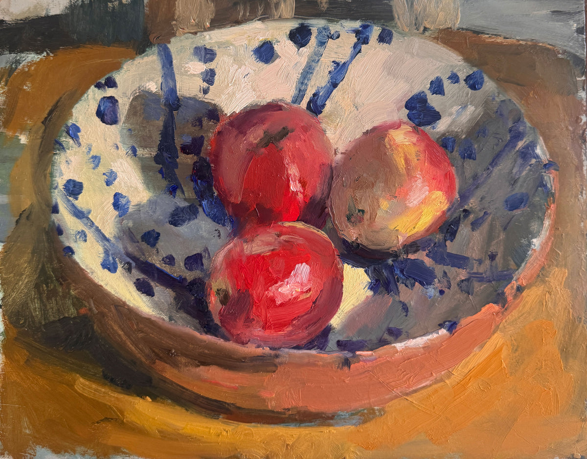Apples in splattered bowl
