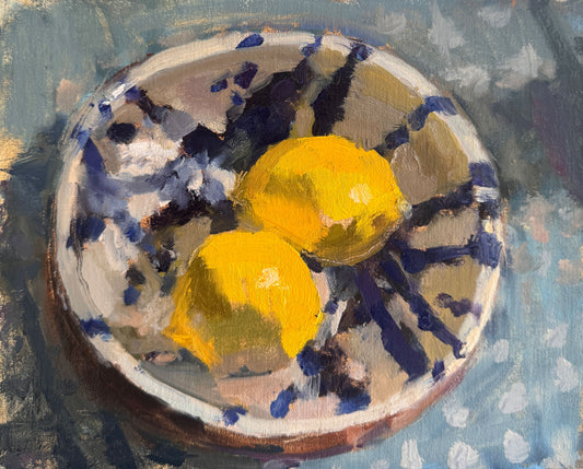Lemon pair in splattered bowl