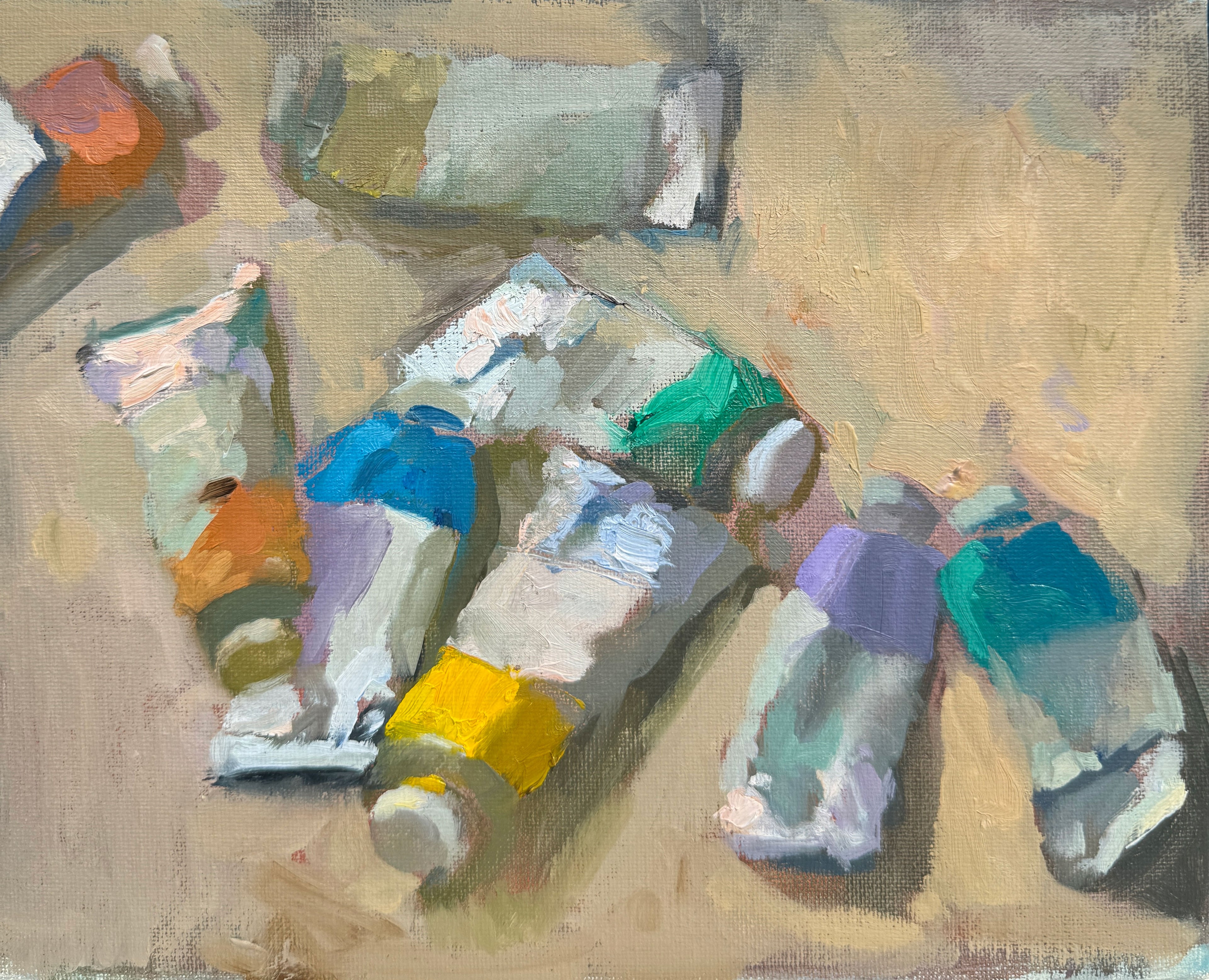 Artistic depiction of colorful paint tubes on a textured surface